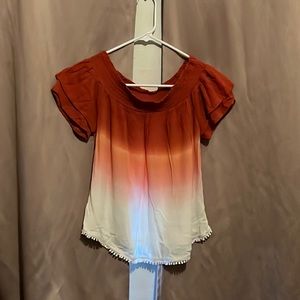 Off the shoulder, salmon-orange shirt